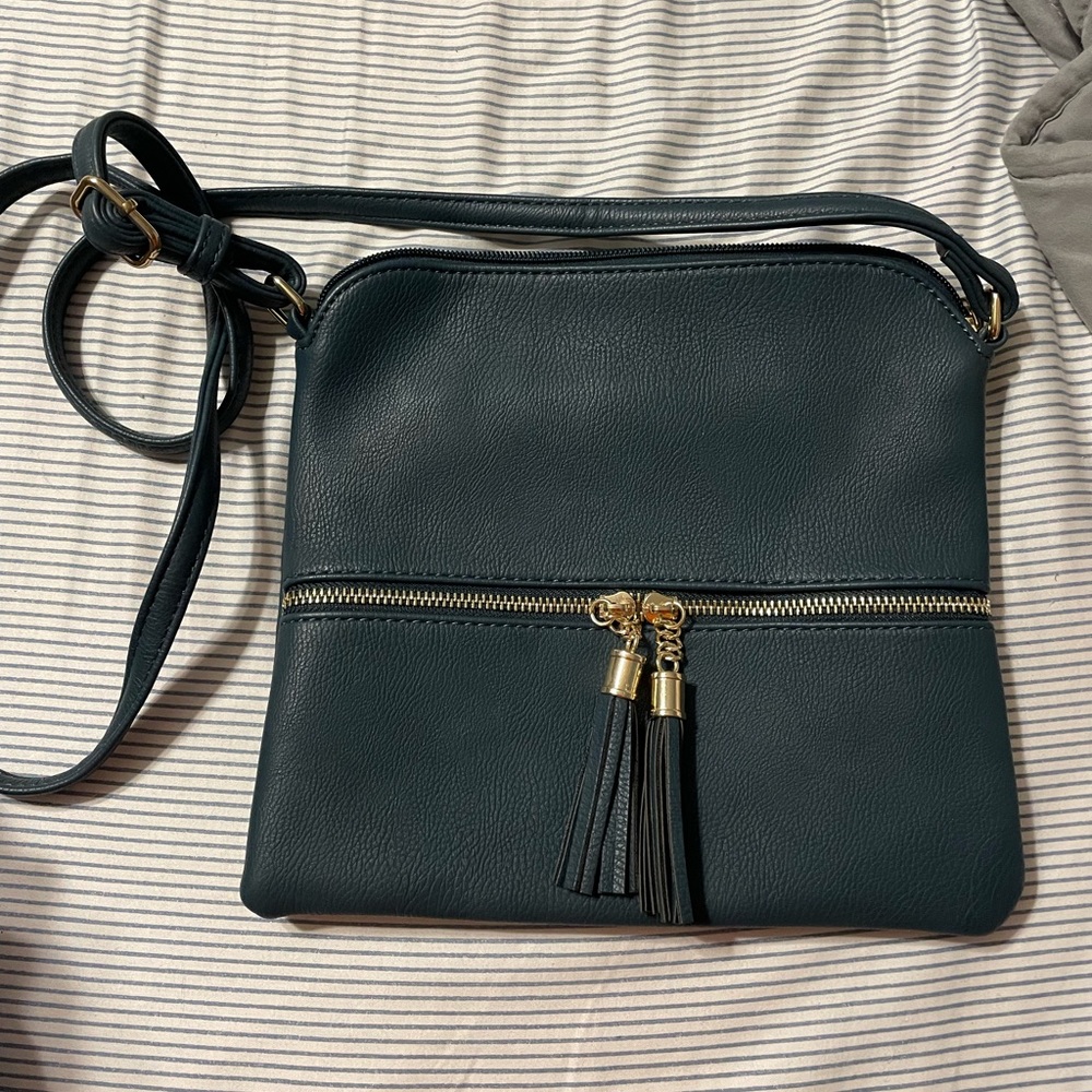 Women’s dark teal blue satchel with tassel detail